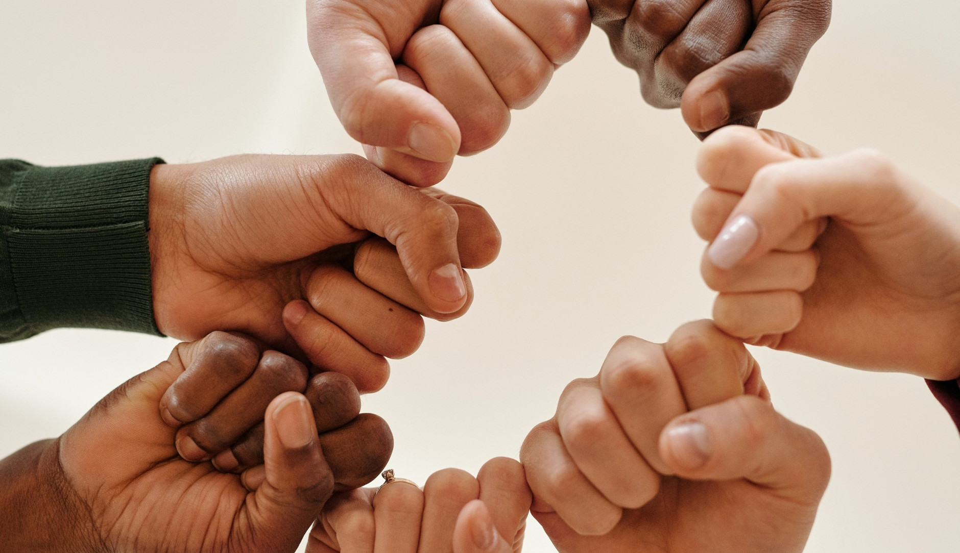 Fists of people with different skin tone