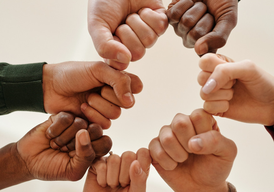Fists of people with different skin tone