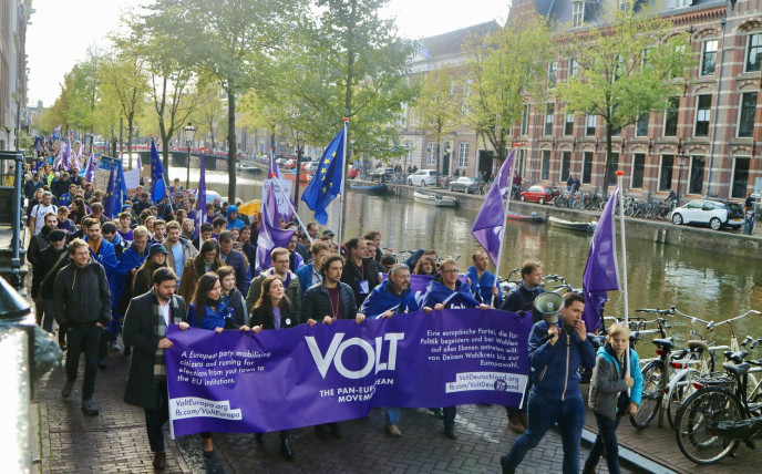 Volt parade in Amsterdam with flag